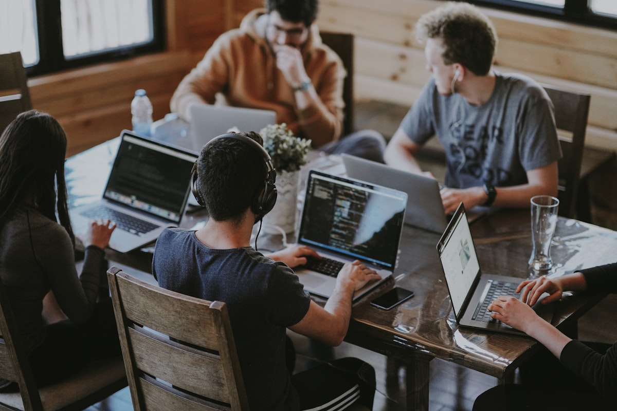 Marketing team collaborating on social media outsourcing strategy